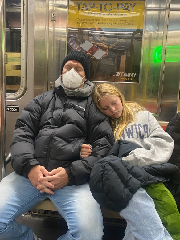 Sam with daughter Scarlett on the New York subway after his hospital stay.