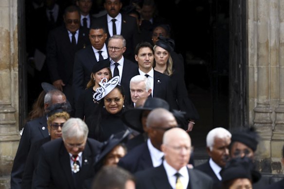 Australian Prime Minister Anthony Albanese with partner Jodie Haydon with Canada's Prime Minister Justin Trudeau and his wife Sophie Trudeau in front as they leave Westminster Abbey.
