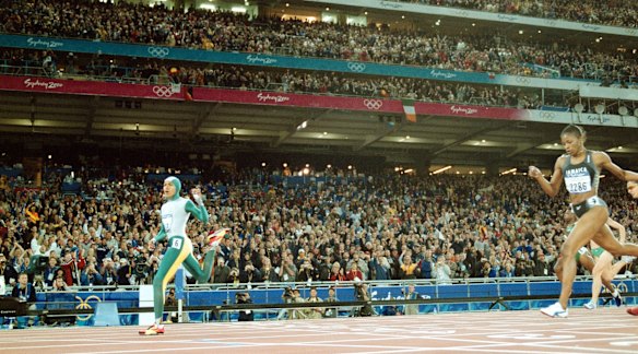 Cathy Freeman crosses the line to win gold in the women's 400 metres.