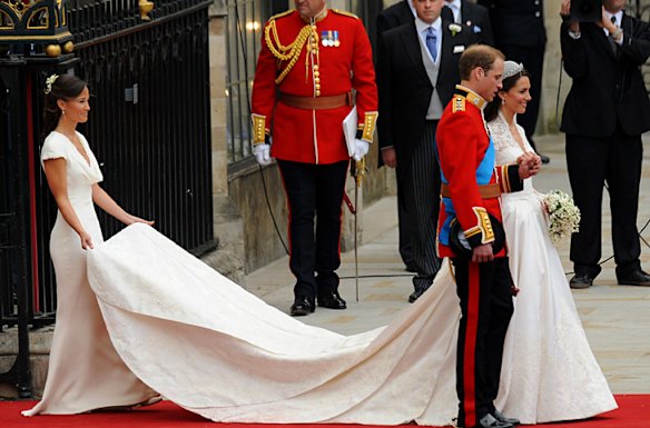 Britain's Prince William and his wife Kate, Duchess of Cambridge pose for photographs at the West Door of Westminster Abbey.