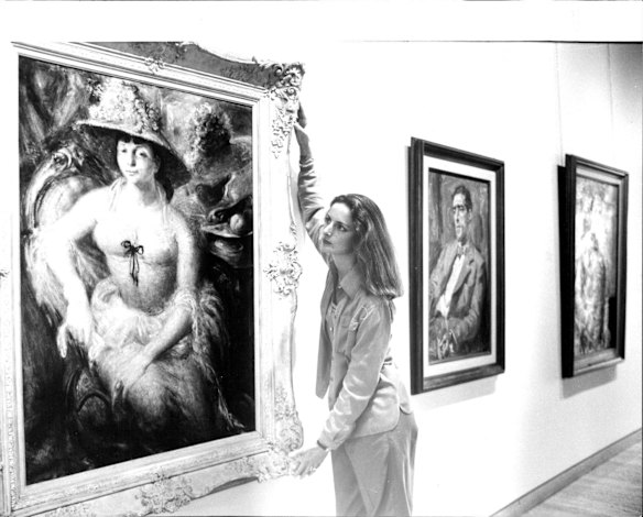 Jane de Teliga, Curatorial Assistant, Art Gallery of NSW pictured with 1948 Archibald Prize, "Margaret Olley" by William Dobell.