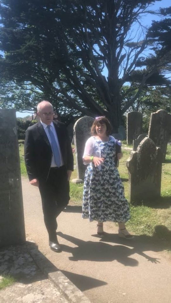 Karen Richards gives Scott Morrison a tour of the St Keverne graveyard.