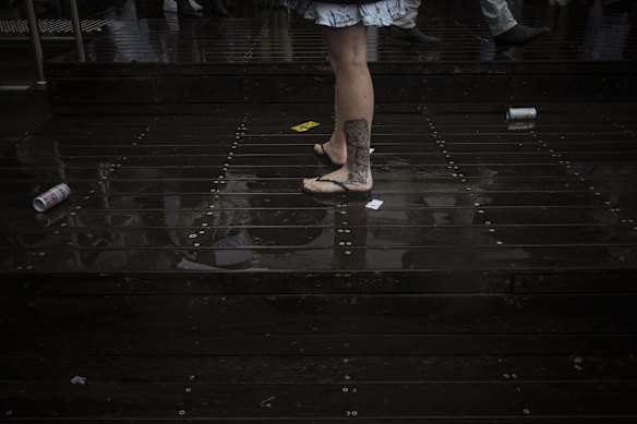 Racegoers ditch the heels at Flemington Racecourse.