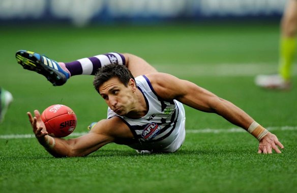 Fremantle's Matthew Pavlich goes for the ball.