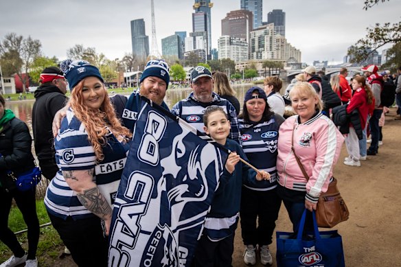 Cats fans Sally Millls and her husband Michael White (left) attend the AFL Grand Final parade 