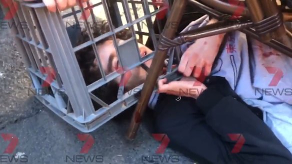 A screenshot from 7 News showing the citizens' arrest of man who allegedly tried to stab people in Sydney.