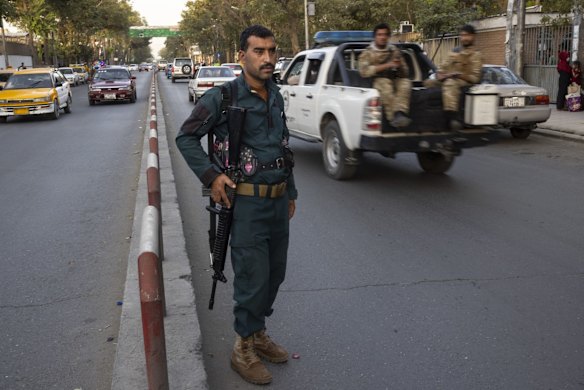 Kabul police secure the road in the central part of the city on August 13, 2021 in Kabul, Afghanistan. Tensions are high as the Taliban advance on the capital city after taking Herat and the country's second-largest city Kandahar.