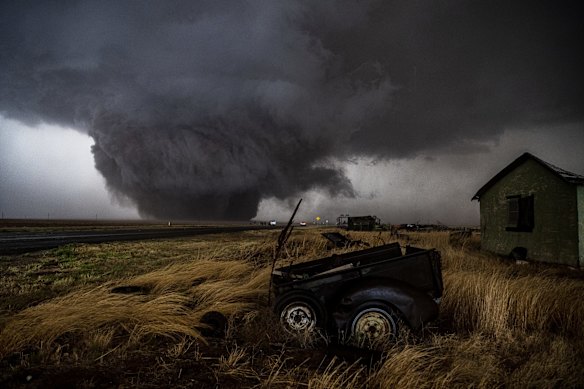 United States: A "wedge" tornado grinds across the prairie land of the Texas Panhandle. Narrowly passing the town of Morton in May, the kilometre-wide twister did little damage except to drought-affected cotton fields.
