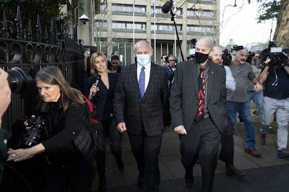 Chris Dawson was found guilty of the murder of his wife Lynette Dawson. Chris' twin Paul and brother Peter Dawson leave the Supreme Court in Sydney after the verdict on August 30. 