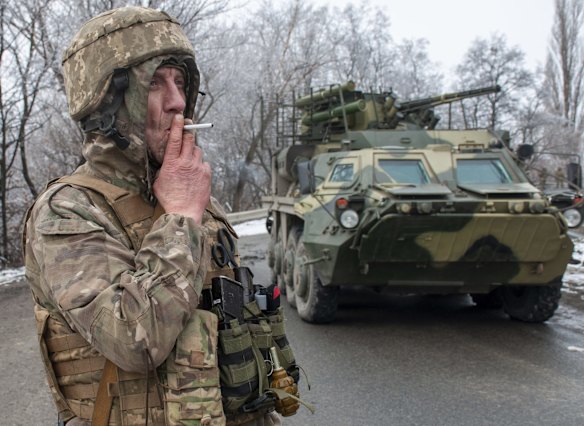 A Ukrainian soldier takes a break outside Kharkiv on Saturday.