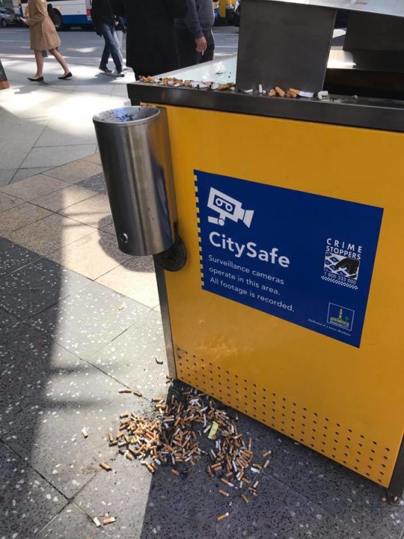 Vandals blamed for cigarette butts being strewn across Brisbane City