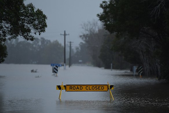 A road is closed due to flooding at Far Meadow in the Shoalhaven area, NSW. 