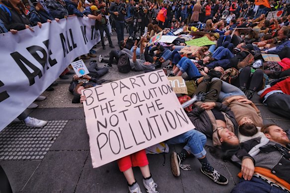 Protesters take part in the Climate Emergency XR Snap Rally in Melbourne.