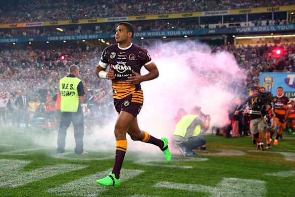 Justin Hodges of the Broncos runs onto the field.
