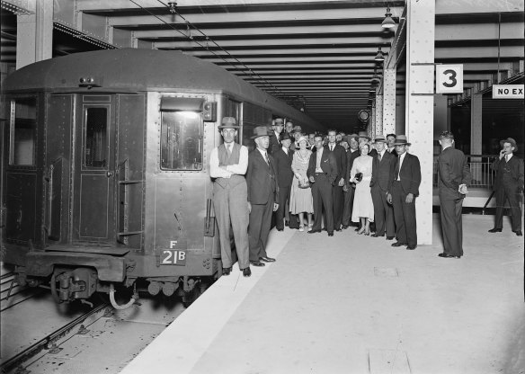 Crowd standing next to the first electric train in the Wynyard underground station, Sydney, 28 February 1932