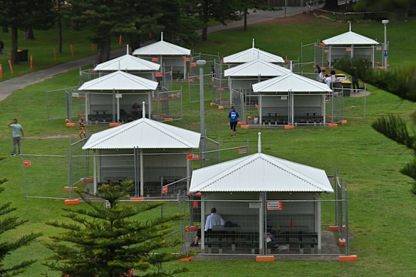 Huts with picnic tables are fenced off as a precaution against COVID-19 on New Years Eve at Bronte Beach in Sydney.