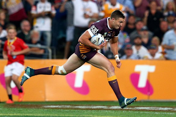 Corey Oates of the Broncos scores a try.