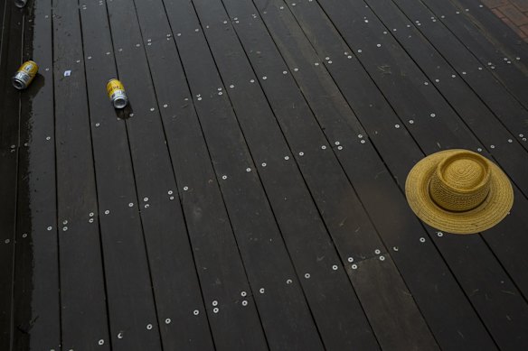 Discarded sunhats and litter at Flemington Racecourse.