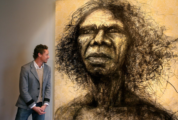 Artist Craig Ruddy with his 2004 Archibald Prize winning portrait of David Gulpilil.