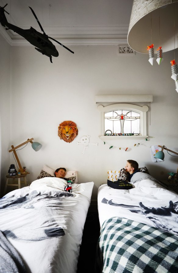“Luca (left) and Arki have their own bedrooms, but still like to bunk in together,” says Amber. The wolf and deer duvet covers are from Danish brand By Nord.