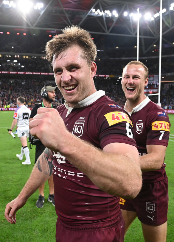 Cameron Munster and Daly Cherry-Evans revel in the glory of an Origin series win. 