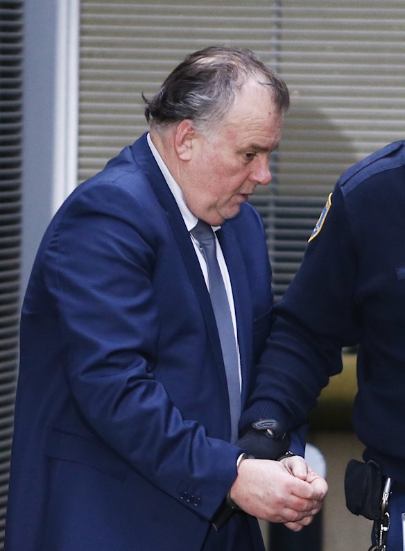 Glenn McNamara is escorted out King St courts during his trial for murder on June 3, 2016 in Sydney, Australia.  