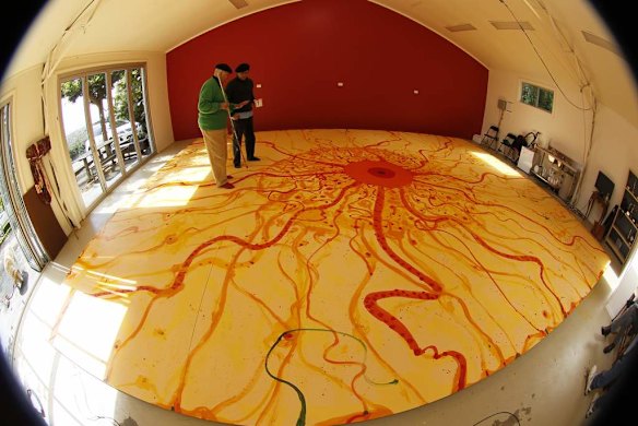 John Olsen, AO, and assistant Carlos Barrios during work on Mr Olsen's largest commissioned work. It will be hung in Melbourne.