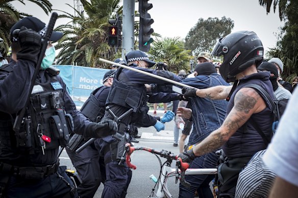 Police clash with protesters outside the NGV.