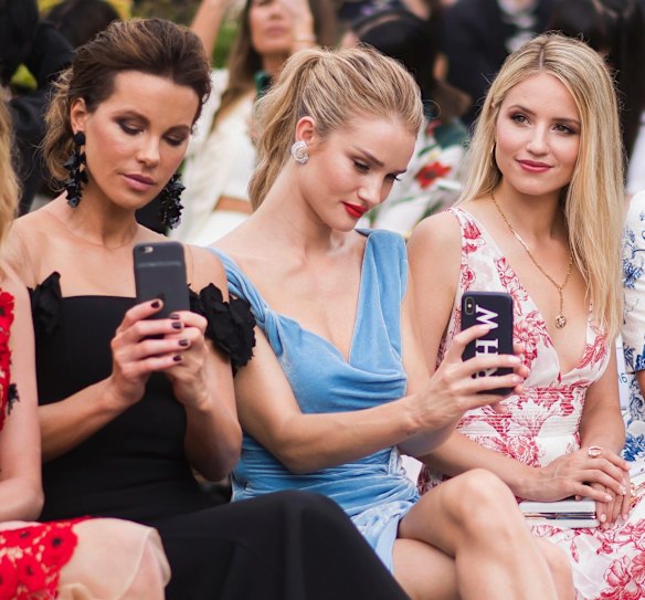 Kate Beckinsale, from left, Rosie Huntington-Whiteley and Dianna Agron attend the Oscar de la Renta show during Fashion Week on Tuesday Sept. 11, 2018 in New York. (Photo by Charles Sykes/Invision/AP)