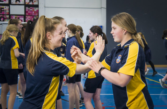 Merici College year 10 students Hayley Browne and Alex Rushton, both 16, who take part in self defence training. 