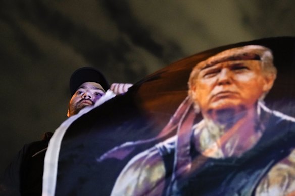 A supporter of President Donald Trump protests in front of the Clark County Election Department in North Las Vegas, Nevada. 