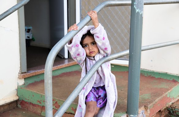 Jayarna Schillingsworth, 3, plays at her great-grandmother's home in Dubbo. Her grandmother, Lee-Anne Ebsworth, was evicted from her public housing home in the Gordon Estate in Dubbo after riots were held in 2006.
