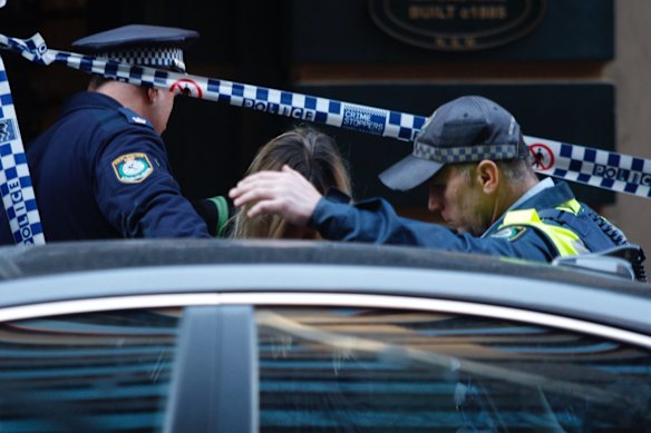 An unidentified woman leaves 118 Clarence Street on Tuesday afternoon.