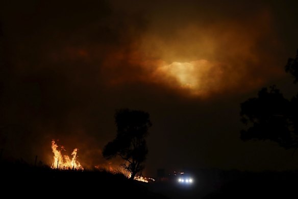 A pyrocumulus cloud from a bushfire burning south of Canberra is visible as the bushfire threatens  communities in Bumbalong.
