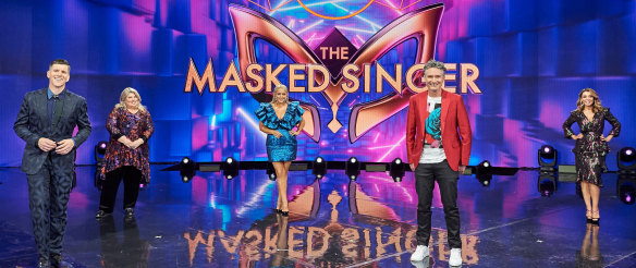 (L-R) Host Osher Gunsberg and judges Urzila Carlson, Jackie O, Dave Hughes and Dannii Minogue on season 2 of The Masked Singer.