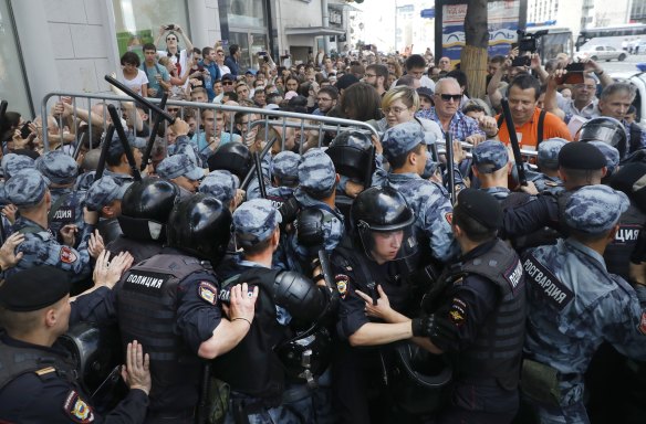 Protesters clash with police in Moscow. 