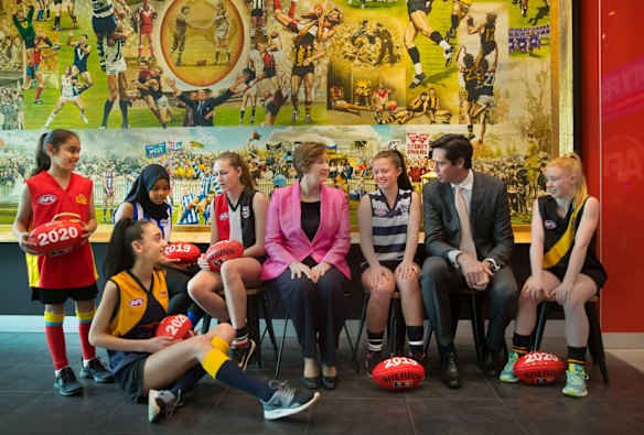 Young footballers Yasmine Taleb, Amren Abrahim, Laila Rabbah, Charlie Clayton, Abbey Boorman and Jayda Young with AFL commissioner Simone Wilkie and AFL CEO Gillon McLachlan.