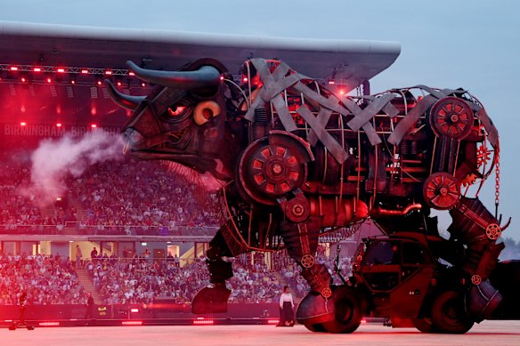 The mechanical bull settled in the middle of the stadium.