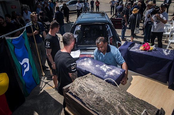 Mungo Man's remains in the red gum box, along with the other ancestors, are loaded into the hearse.