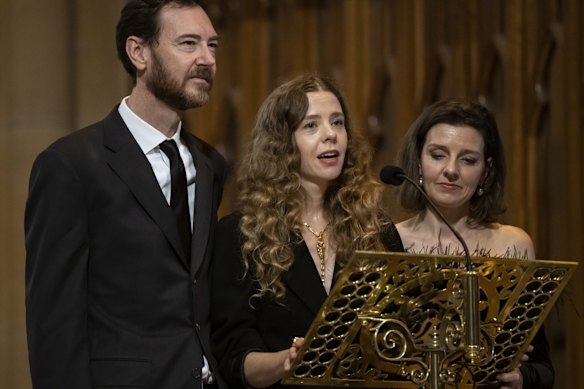 From left, Alexander Schuman, Bianca and Allegra Spender speak at their mother's funeral.