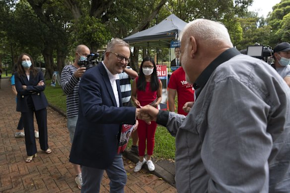 Australian Labor leader Anthony Albanese (centre) meets voters at the Burwood Community Centre during the Strathfield byelection.