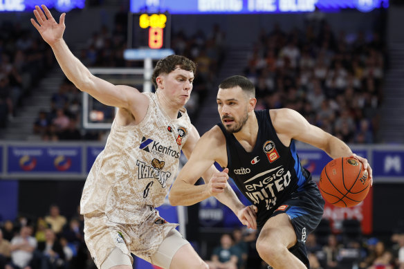 United gun Chris Goulding drives to the basket against Cairns’ Jonah Antonio on Sunday.