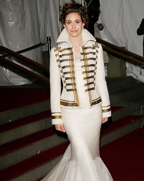 Emmy Rossum's white satin dress was bad enough by itself, but the marching band jacked with popped collar wade it 10 times worse. 