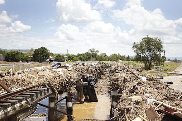 Emergency services search for bodies in the town of Grantham, in the Lockyer Valley, which was devastated by a sudden flood on January 10. Photo: Dean Saffron