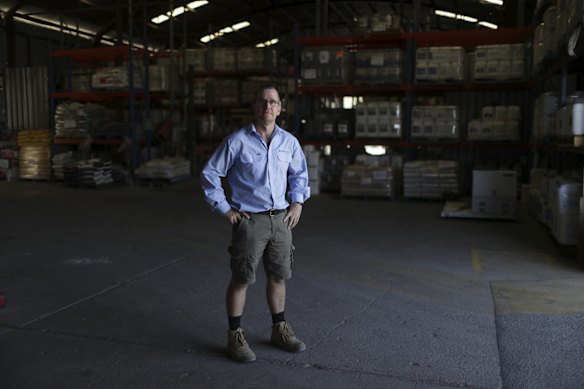 McGregor Gourlay branch manager Mick Jensen in the warehouse in Moree. Their workers took a 20 per cent pay cut and work four days a week due to the impacts of the drought.