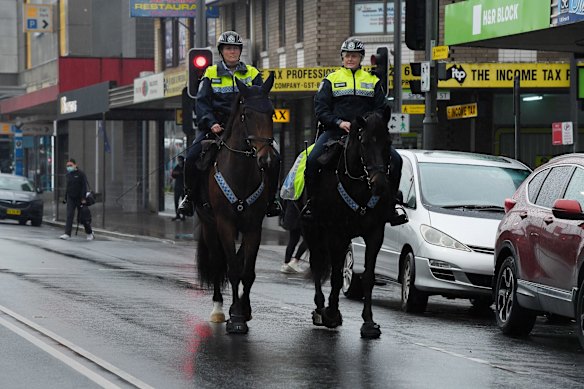 NSW Mounted Police patrol the streets of Fairfield during Sydney's COVID-19 lockdown. Police increase their presence after numbers grow in Sydney's South West.
