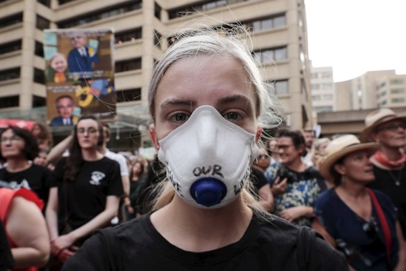 Thousands gather at Town Hall in Sydney CBD to demand action on climate change.