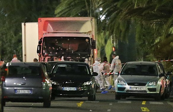 The truck which slammed into revelers late Thursday, July 14, is seen near the site of an attack in the French resort city of Nice, southern France, Friday, July 15, 2016. 
