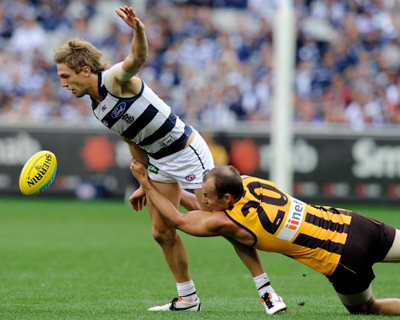 Geelong's Billie Smedts is tackled by David Hale.