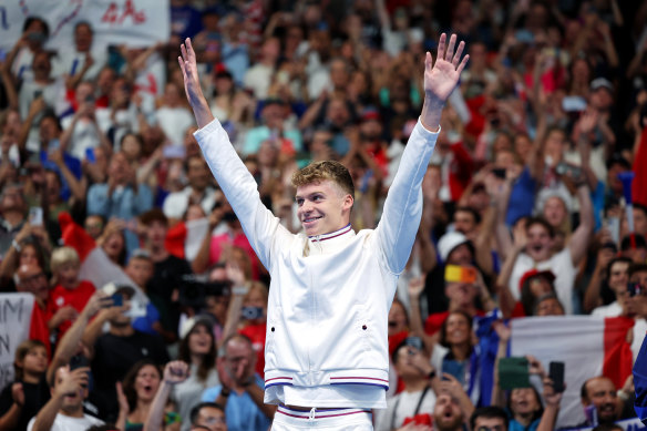 Leon Marchand, the brightest star of the Paris pool, celebrates one of his four gold medals.